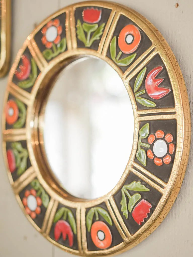 Round mid-century modern mirror w/ yellow & orange flowers - Mithe Espelt (1924-2021) - 11½"